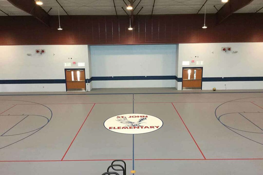 st john elementary gym construction basketball floor